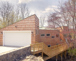 The updated roof line transformed the house from a split level ranch to a contem