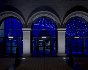 The lighting installation swoops down to the concierge customer service desk